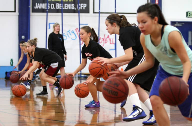 DHS girls basketball coach Karen Foster watches, from right, Kira Prieditis, Ashleigh Vanderbrink, Anna Belenis, Becca Hassid, Kylie Drexel and Tori Powell conduct coordination drills Monday. Fred Gladdis/Enterprise photo